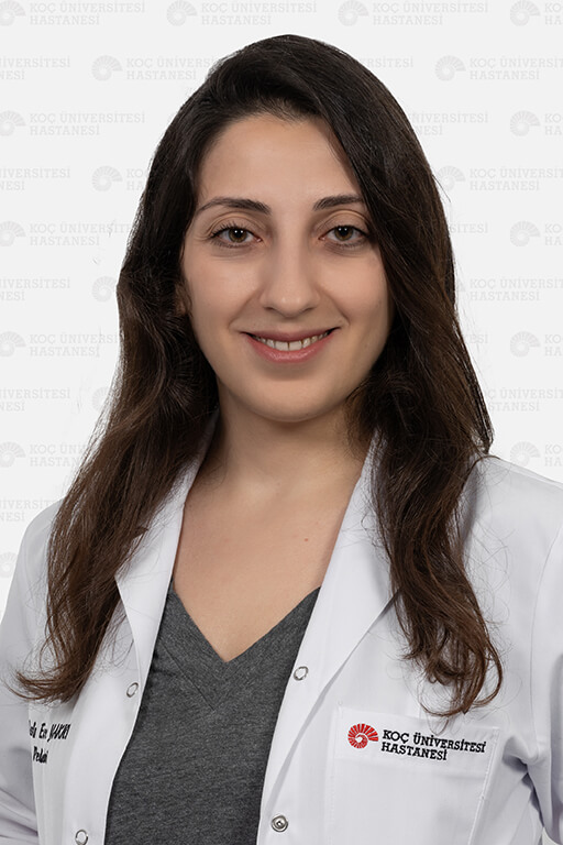 Aslı Ece Zeybek, MD — official Koç University Hospital photograph, white coat